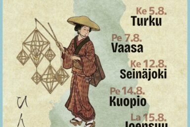 japanilainen henkilö pitelee himmeliä, taustalla Suomen kartta
